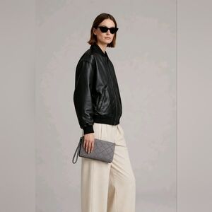 Michael Kors Daniela grommeted leather wristlet in gray